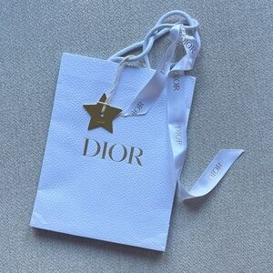 Authentic Dior textured bag with metal gold star charm & branded ribbon